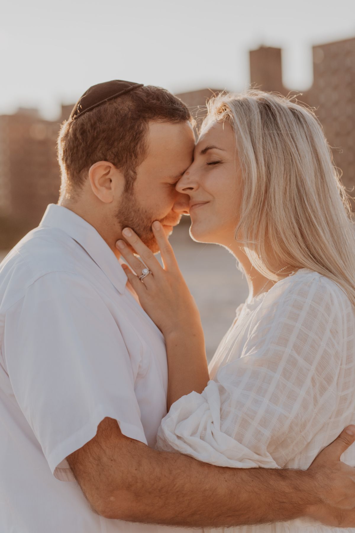 Sarah and Daniel holding each other at golden hour